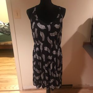 Black mini dress with white feather pattern